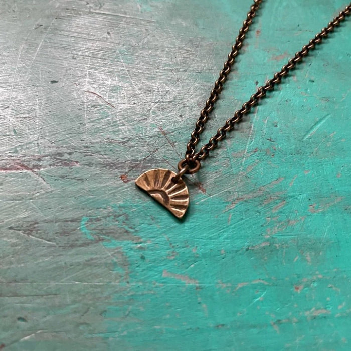 Tiny Brass Sunburst Necklace